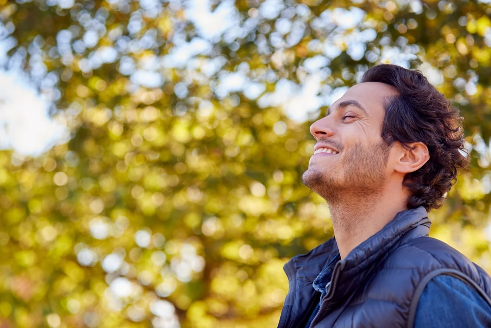 man enjoying a fresh breath through his nose